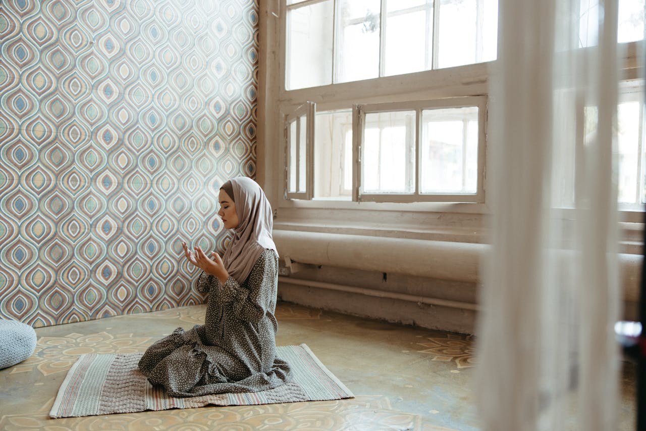 a men praying on prayer mat